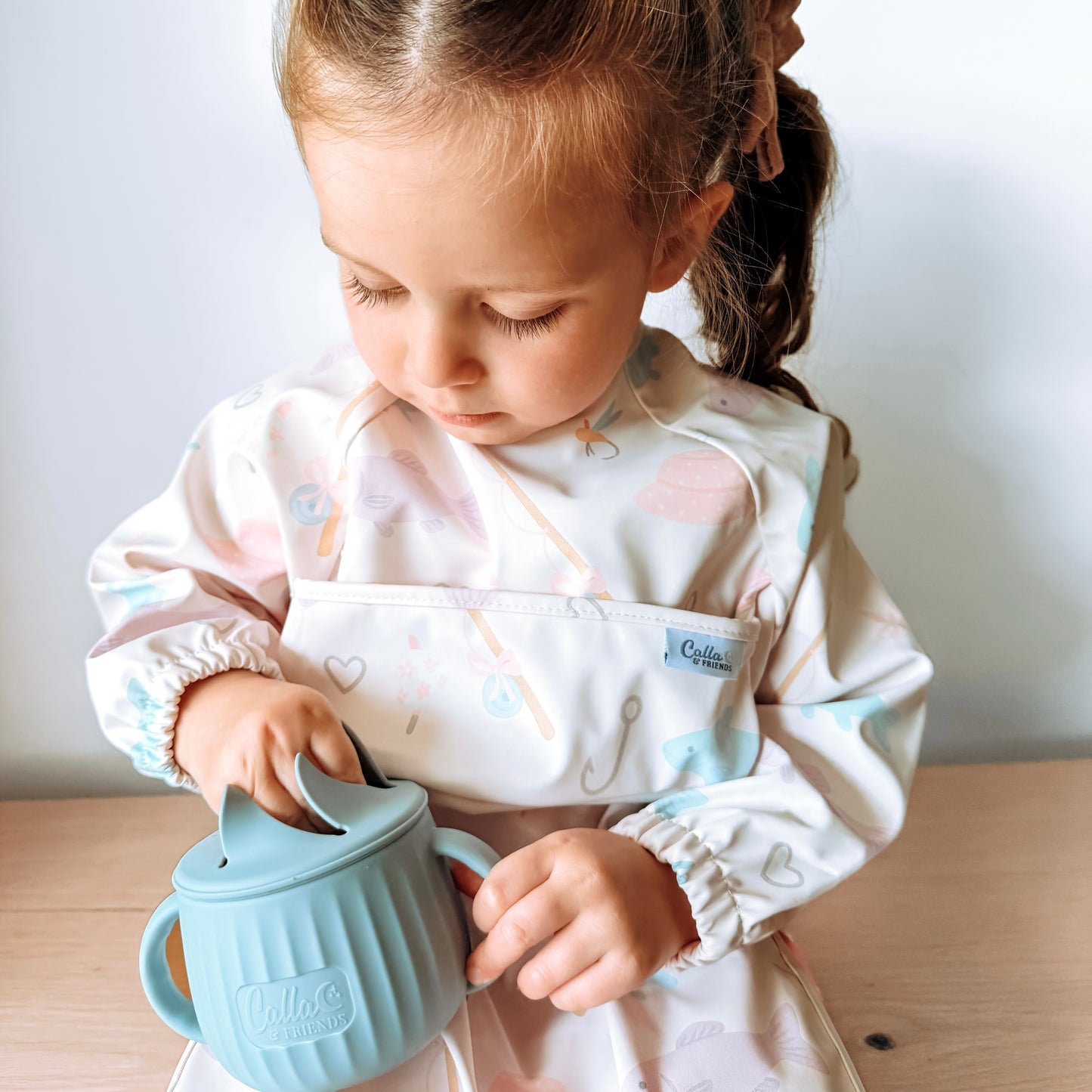 The Grayson Long Sleeve Bib - Lakeside Blooms